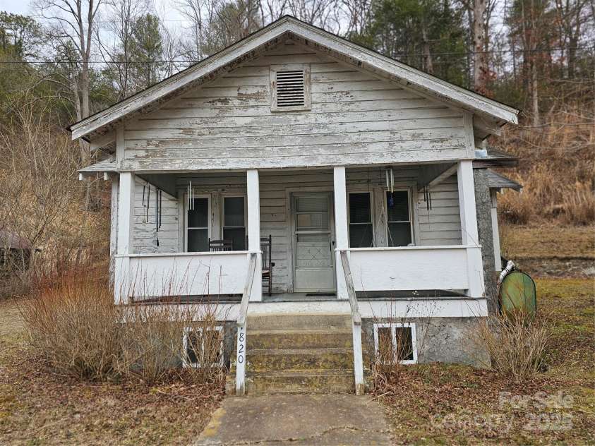 1820 Grapevine Road, Marshall, NC 28753.  MLS# CAR4219221, YatesRealty ID 3230. Front of farmhouse, roof replaced in 2017