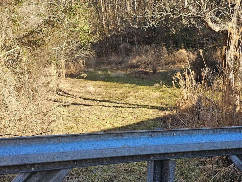 1820 Grapevine Road, Marshall, NC 28753.  MLS# CAR4219221, YatesRealty ID 3230. Gate from Barn to homesites