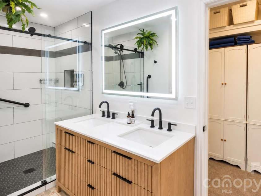 2698 Connestee Trail, Brevard, NC 28712.  MLS# CAR4371714, YatesRealty ID 32300. Gorgeous primary bathroom with double vanity