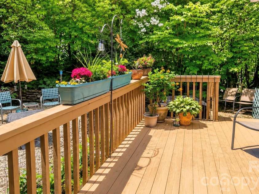2698 Connestee Trail, Brevard, NC 28712.  MLS# CAR4371714, YatesRealty ID 32300. The back deck gets ample sun, perfect for container gardens