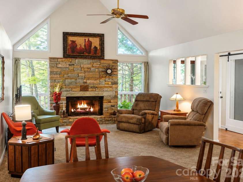 2698 Connestee Trail, Brevard, NC 28712.  MLS# CAR4371714, YatesRealty ID 32300. The open living/dining area make entertaining easy