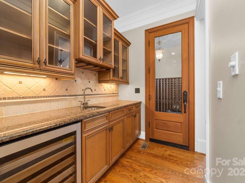 14504 Henry Harrison Stillwell Drive, Huntersville, NC 28078.  MLS# CAR4288907, YatesRealty ID 32304. Beverage area near wine cellar and dining room