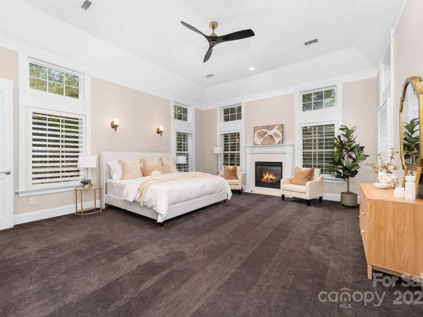 14504 Henry Harrison Stillwell Drive, Huntersville, NC 28078.  MLS# CAR4288907, YatesRealty ID 32304. Second fireplace in primary bedroom