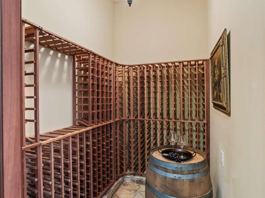 14504 Henry Harrison Stillwell Drive, Huntersville, NC 28078.  MLS# CAR4288907, YatesRealty ID 32304. Wine cellar