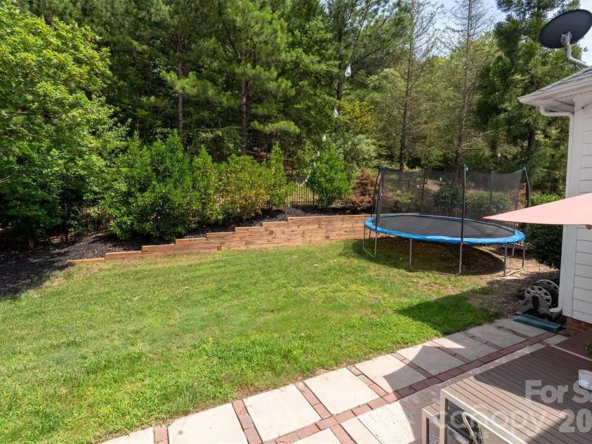 869 Stratford Run Drive, Fort Mill, SC 29708.  MLS# CAR4364217, YatesRealty ID 32304. Fenced yard backing to woods