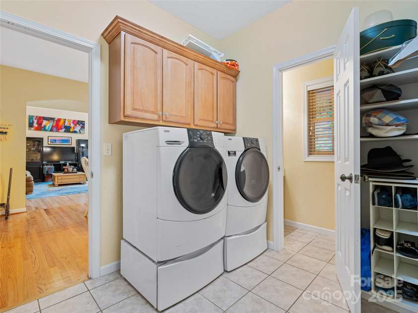 808 Old Fort Road, Fairview, NC 28730.  MLS# CAR4281084, YatesRealty ID 32308. Located on the main and off the garage is this laundry room with drop zone and entrance to powder room.