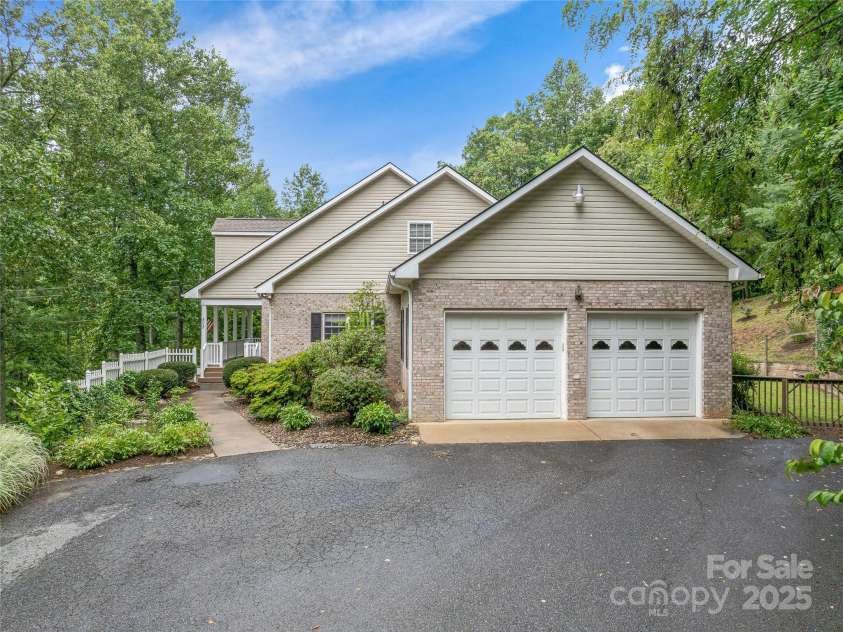 808 Old Fort Road, Fairview, NC 28730.  MLS# CAR4281084, YatesRealty ID 32308. Parking abounds with 2 driveways, a 2 car garage on the main level & a 1 car garage on the lower level.