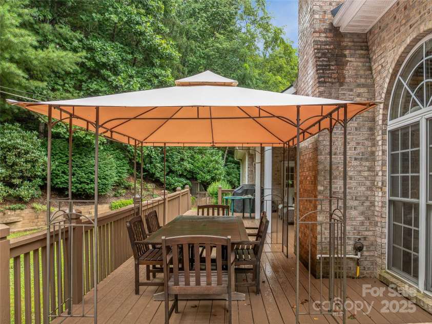 808 Old Fort Road, Fairview, NC 28730.  MLS# CAR4281084, YatesRealty ID 32308. Step out the back door onto this beautiful deck which features this covered canopy and flat back yard.