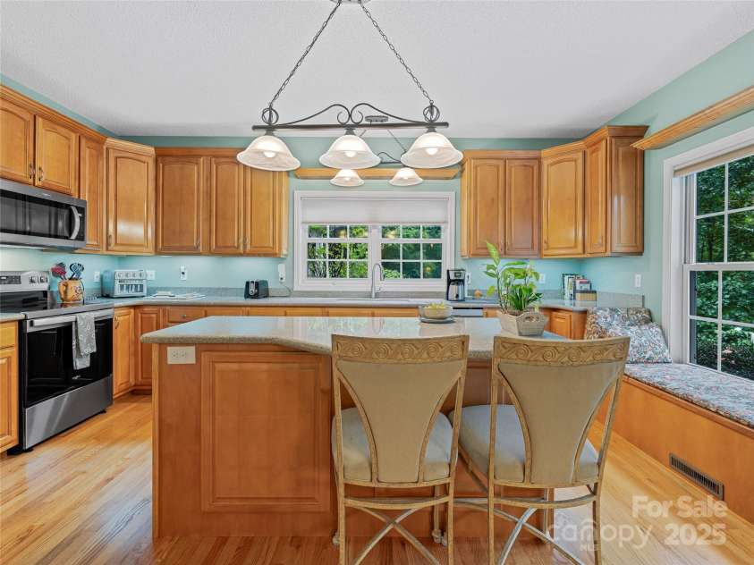 808 Old Fort Road, Fairview, NC 28730.  MLS# CAR4281084, YatesRealty ID 32308. The kitchen is ample and perfect for entertaining. Silestone countertops, stainless appliances, abundant storage.