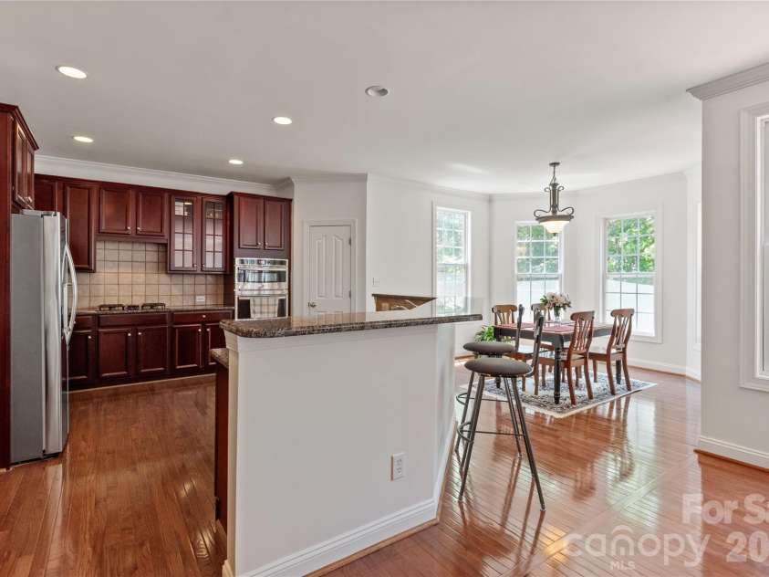 8914 Landsdowne Avenue, Harrisburg, NC 28075.  MLS# CAR4259422, YatesRealty ID 3231. Kitchen and view of breakfast area.