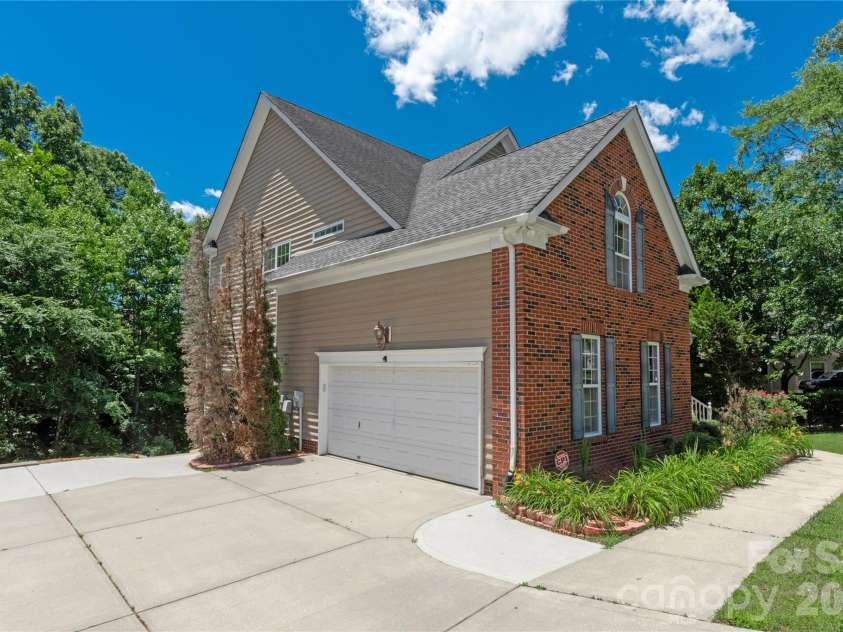 8914 Landsdowne Avenue, Harrisburg, NC 28075.  MLS# CAR4259422, YatesRealty ID 3231. Side load view to garage.