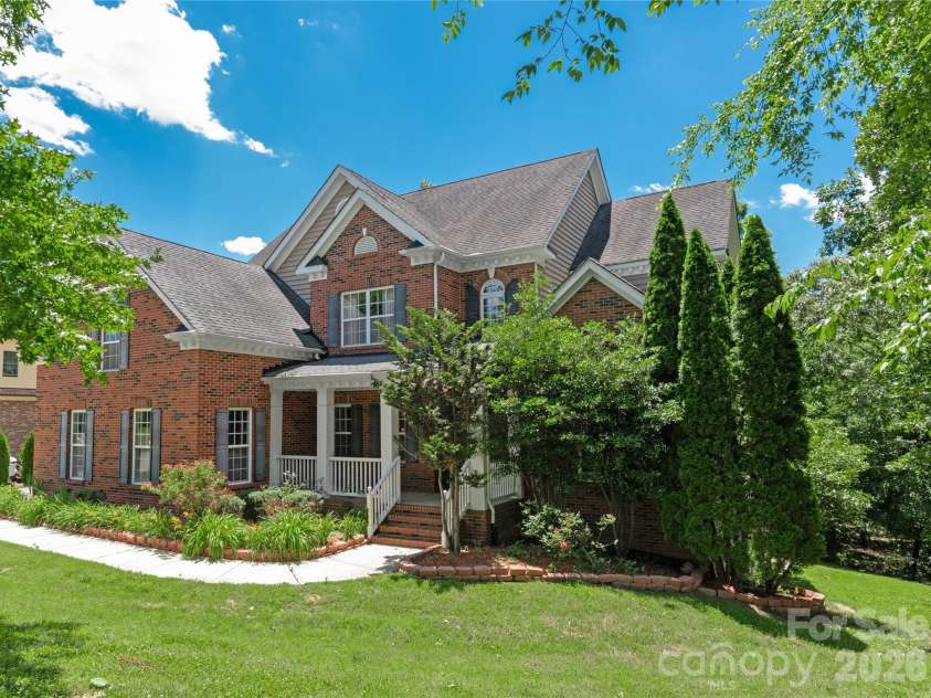 8914 Landsdowne Avenue, Harrisburg, NC 28075.  MLS# CAR4259422, YatesRealty ID 3231. Side view of home.