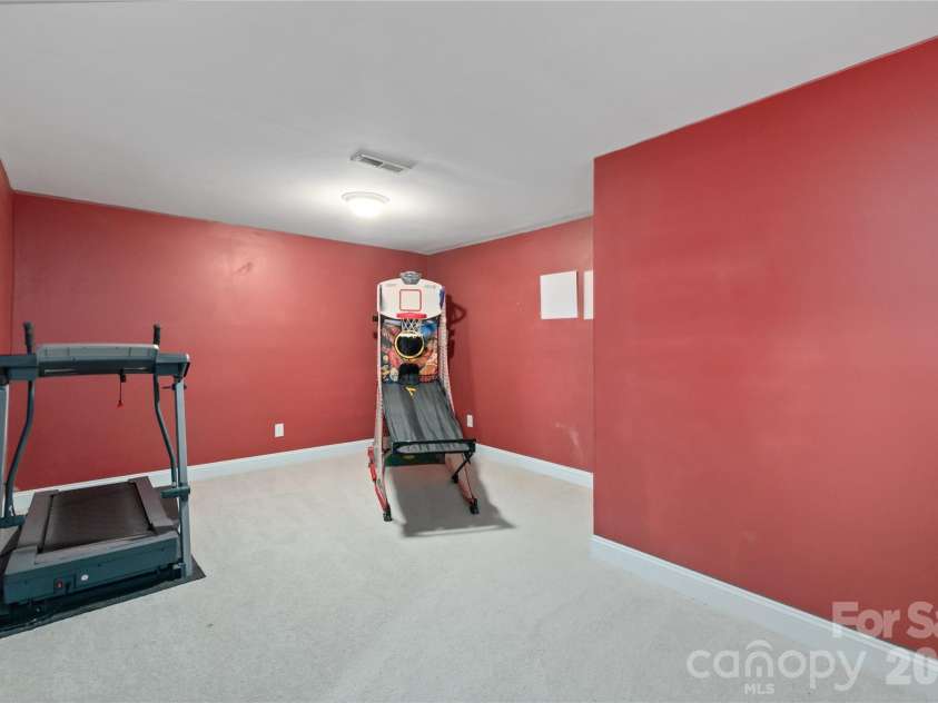 8914 Landsdowne Avenue, Harrisburg, NC 28075.  MLS# CAR4259422, YatesRealty ID 3231. Spacious exercise area in the basement.