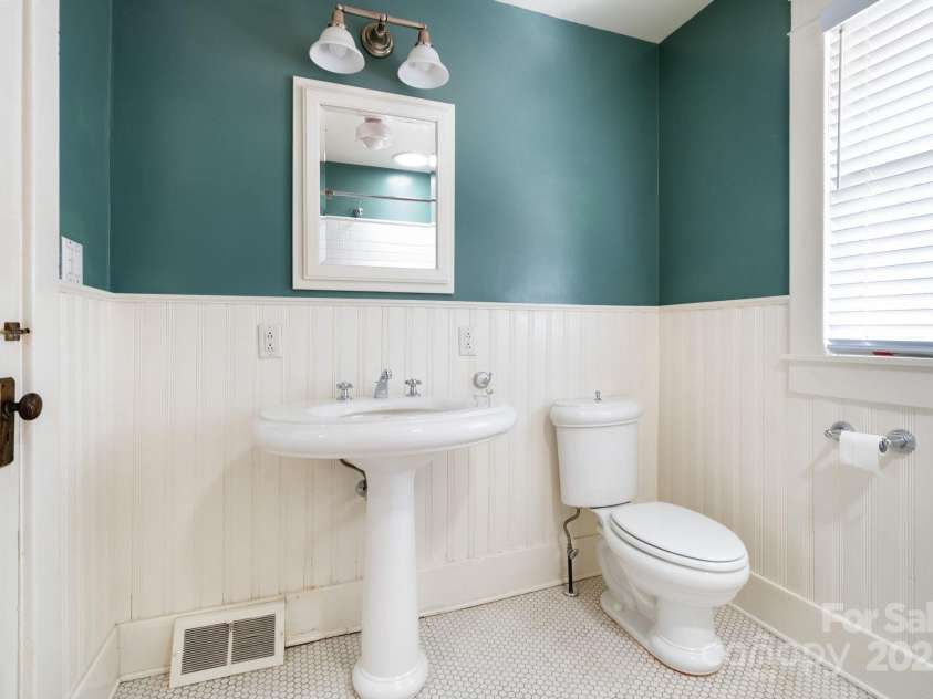 30 Monroe Place, Asheville, NC 28801.  MLS# CAR4284372, YatesRealty ID 32311. Charming Bath with Pedestal Sink...