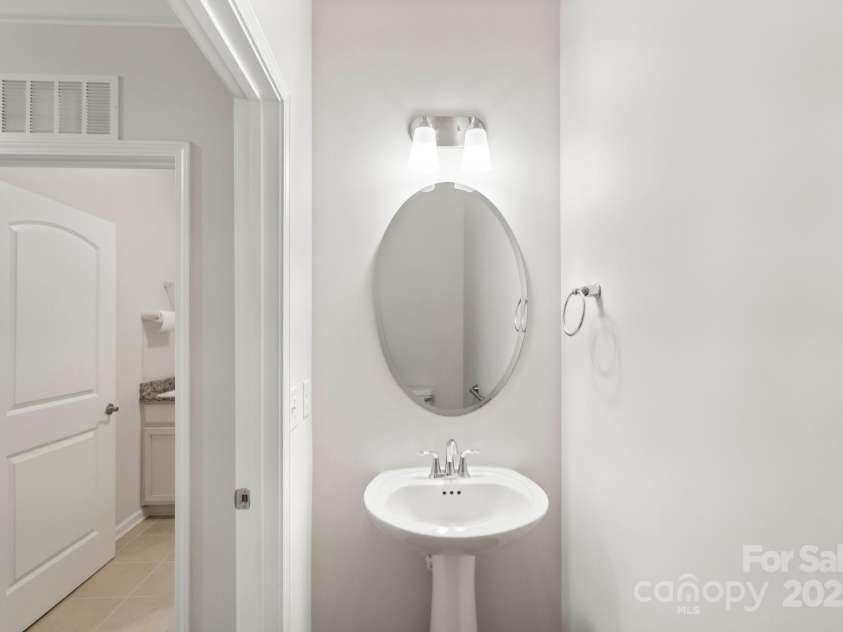 360 Picasso Trail, Mount Holly, NC 28120.  MLS# CAR4289859, YatesRealty ID 32319. Half Bath Near Garage Entrance