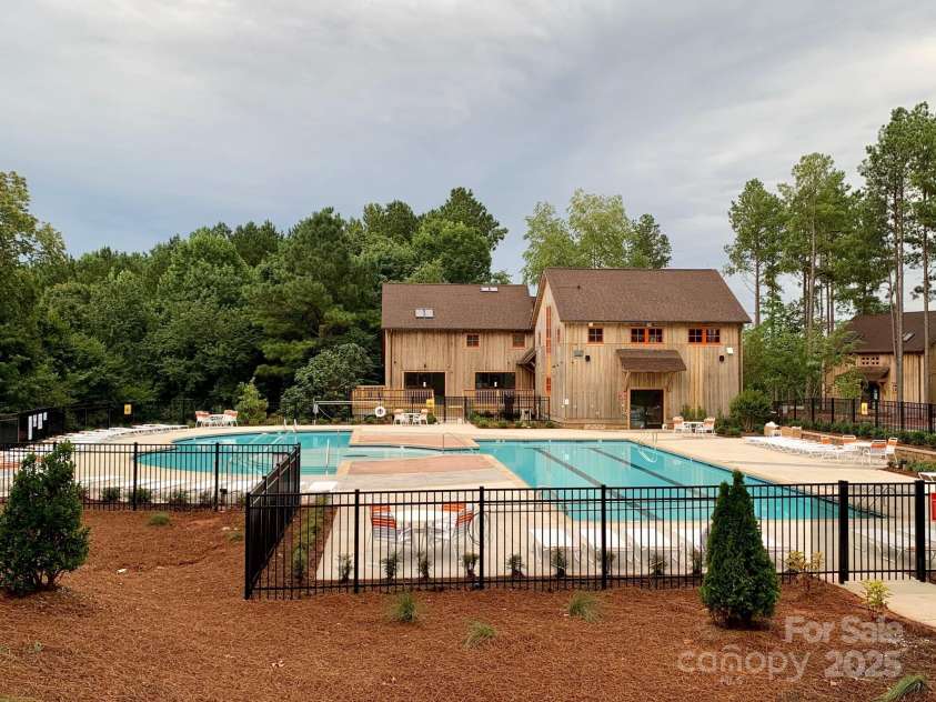 360 Picasso Trail, Mount Holly, NC 28120.  MLS# CAR4289859, YatesRealty ID 32319. Heated Pools with Cabins