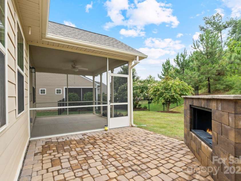 360 Picasso Trail, Mount Holly, NC 28120.  MLS# CAR4289859, YatesRealty ID 32319. Patio with Gas Fireplace