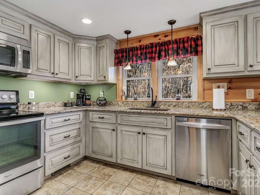 120 Sweetbriar Road, Lake Lure, NC 28746.  MLS# CAR4291551, YatesRealty ID 32337. Windows over the sink allow natural light and private nature views.