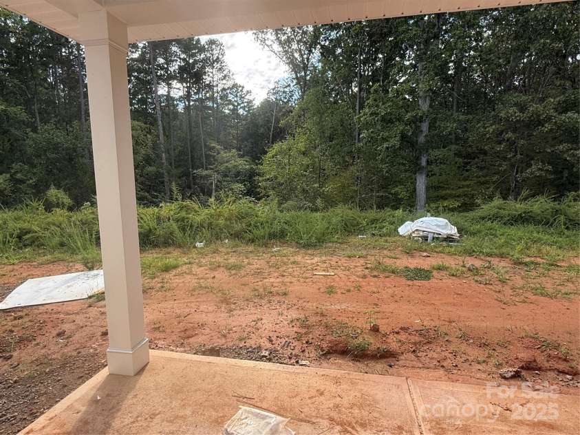 3949 Port Richmond Avenue, Gastonia, NC 28056.  MLS# CAR4292369, YatesRealty ID 32341. Covered Back Patio w/ Tree Lined View