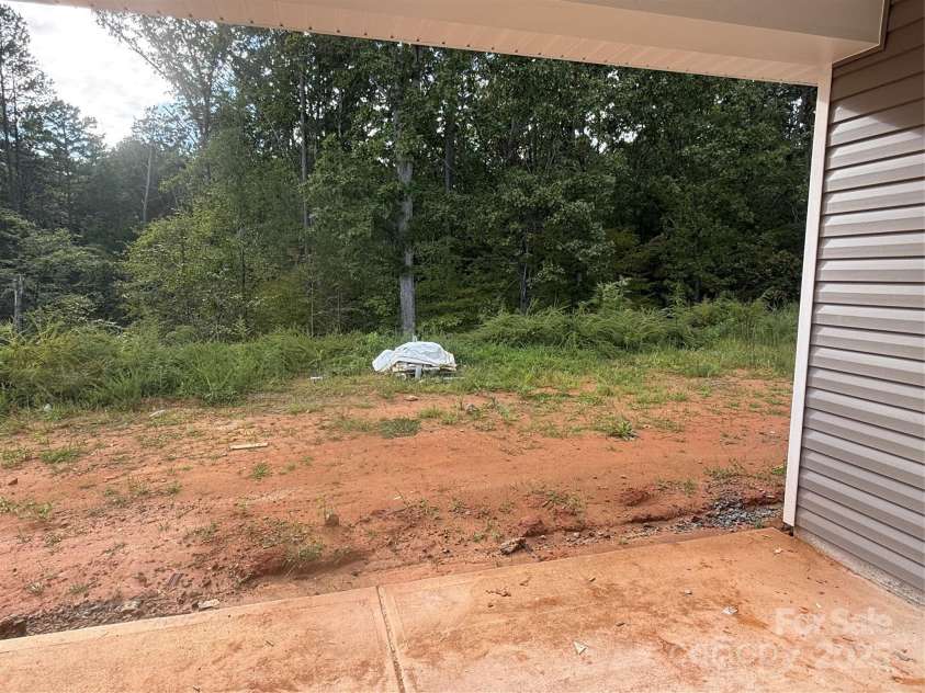 3949 Port Richmond Avenue, Gastonia, NC 28056.  MLS# CAR4292369, YatesRealty ID 32341. Covered Back Patio w/ Tree Lined View