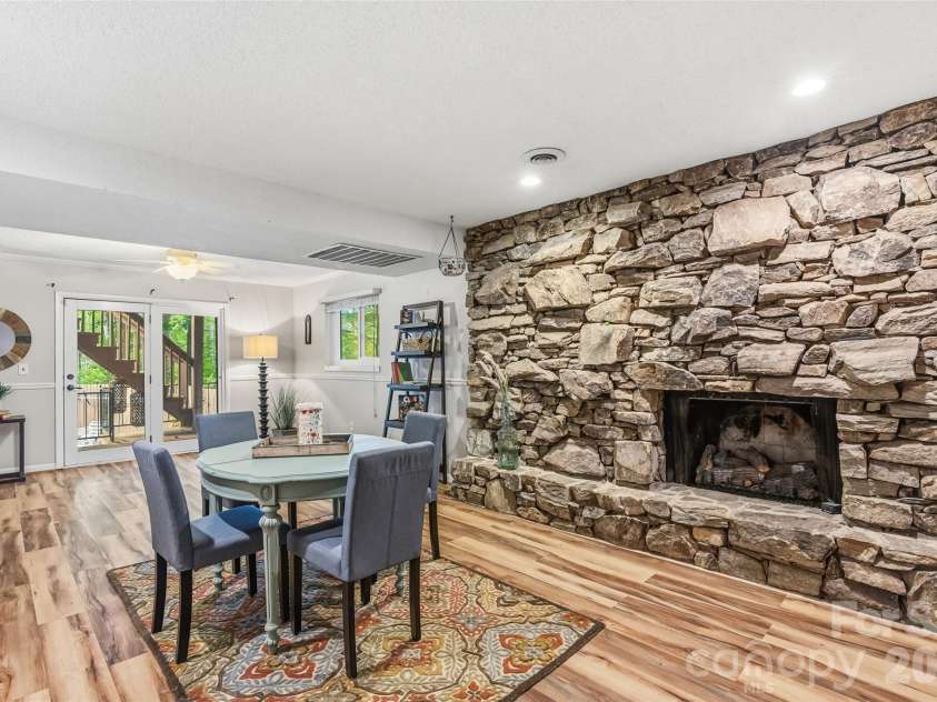 16 Canterbury Drive, Arden, NC 28704.  MLS# CAR4396207, YatesRealty ID 32349. Downstairs has a fabulous den with massive fireplace