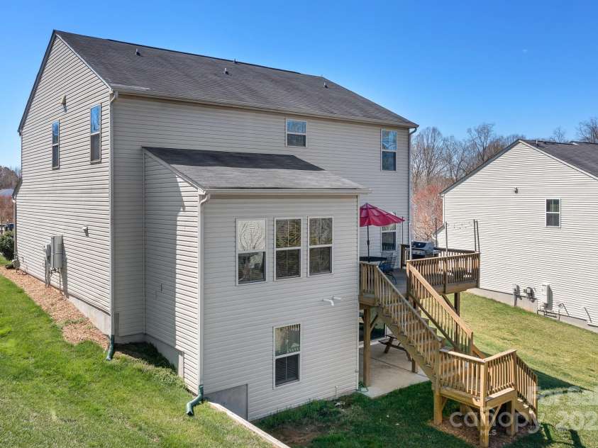 7217 Kenyon Drive, Denver, NC 28037.  MLS# CAR4233366, YatesRealty ID 3235. Back of home with deck and patio