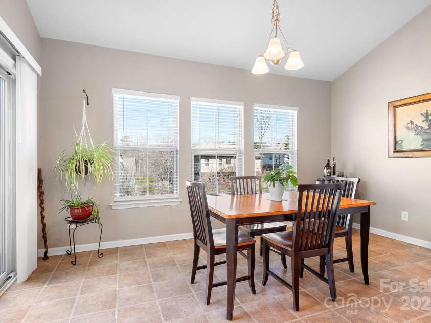 7217 Kenyon Drive, Denver, NC 28037.  MLS# CAR4233366, YatesRealty ID 3235. Breakfast area with sliding doors to deck