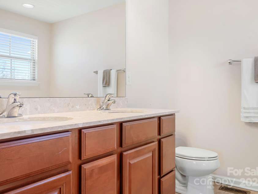 7217 Kenyon Drive, Denver, NC 28037.  MLS# CAR4233366, YatesRealty ID 3235. Primary bathroom with double sinks