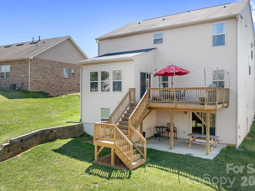 7217 Kenyon Drive, Denver, NC 28037.  MLS# CAR4316332, YatesRealty ID 3235. Back of home with deck and patio 