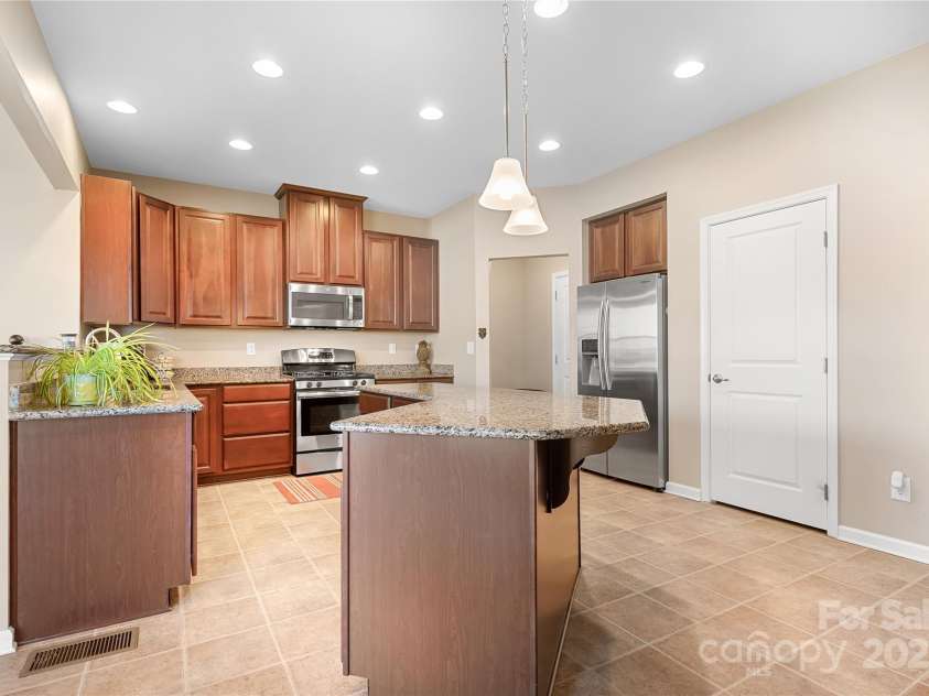 7217 Kenyon Drive, Denver, NC 28037.  MLS# CAR4316332, YatesRealty ID 3235. Kitchen with pantry