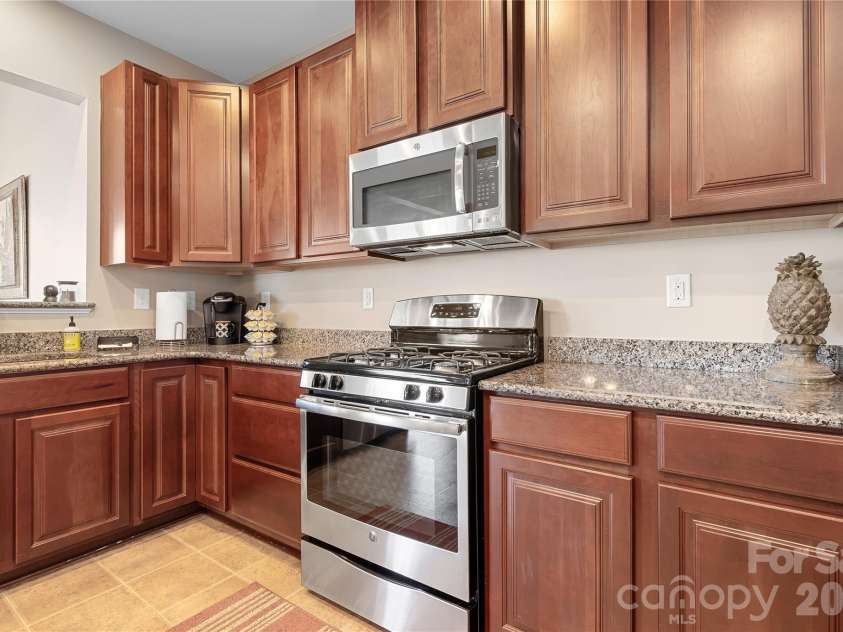 7217 Kenyon Drive, Denver, NC 28037.  MLS# CAR4316332, YatesRealty ID 3235. Stainless steel appliances with gas range/microwave 