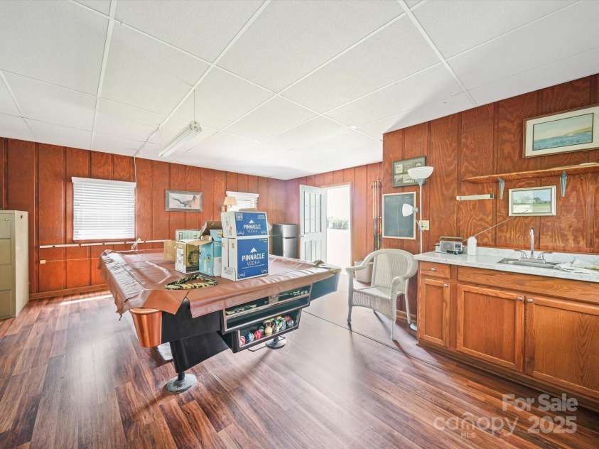 16801 Randalls Ferry Road, Norwood, NC 28128.  MLS# CAR4285843, YatesRealty ID 32356. Office in Milking Parlor has window hvac unit.