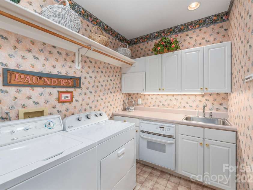 31 Chickering Lane, Waynesville, NC 28786.  MLS# CAR4278199, YatesRealty ID 32361. Laundry room with sink and extra oven
