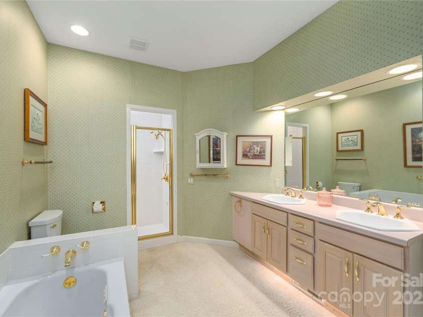31 Chickering Lane, Waynesville, NC 28786.  MLS# CAR4278199, YatesRealty ID 32361. Primary bath with spa tub and shower