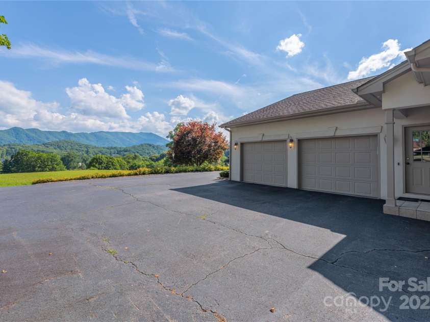 31 Chickering Lane, Waynesville, NC 28786.  MLS# CAR4278199, YatesRealty ID 32361. Two plus car garage