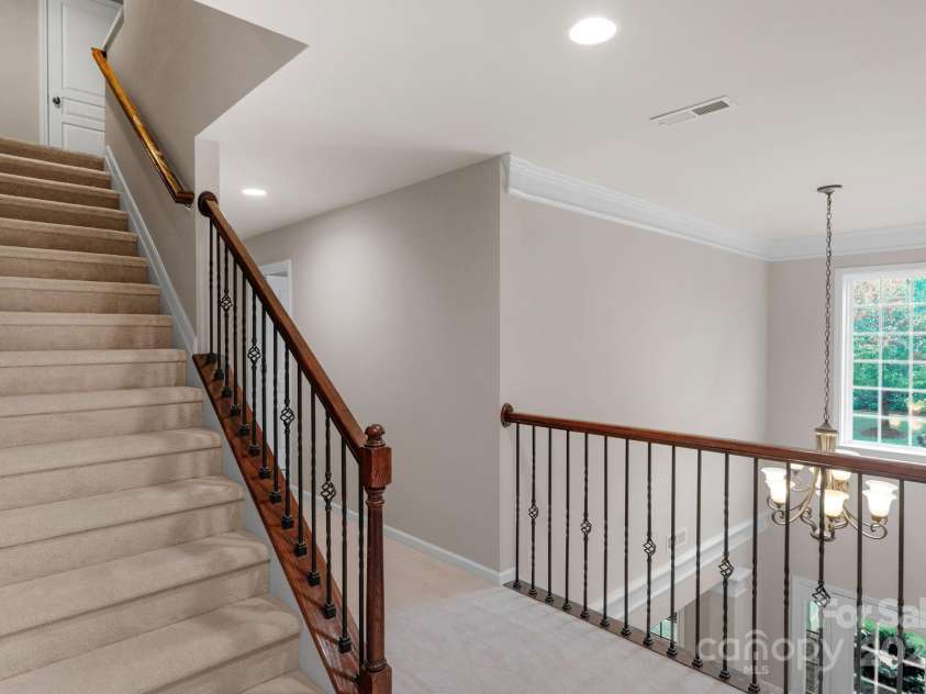 10604 Waxhaw Manor Drive, Waxhaw, NC 28173.  MLS# CAR4287173, YatesRealty ID 32364. Stairs to 3rd floor