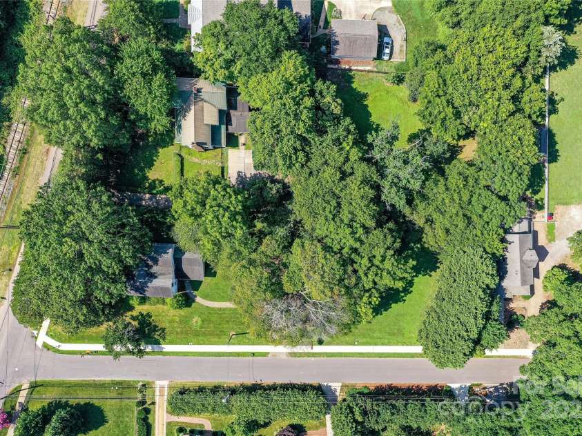 504 Potts Street, Davidson, NC 28036.  MLS# CAR4274445, YatesRealty ID 32365. Close in aerial shot of the parcel facing South