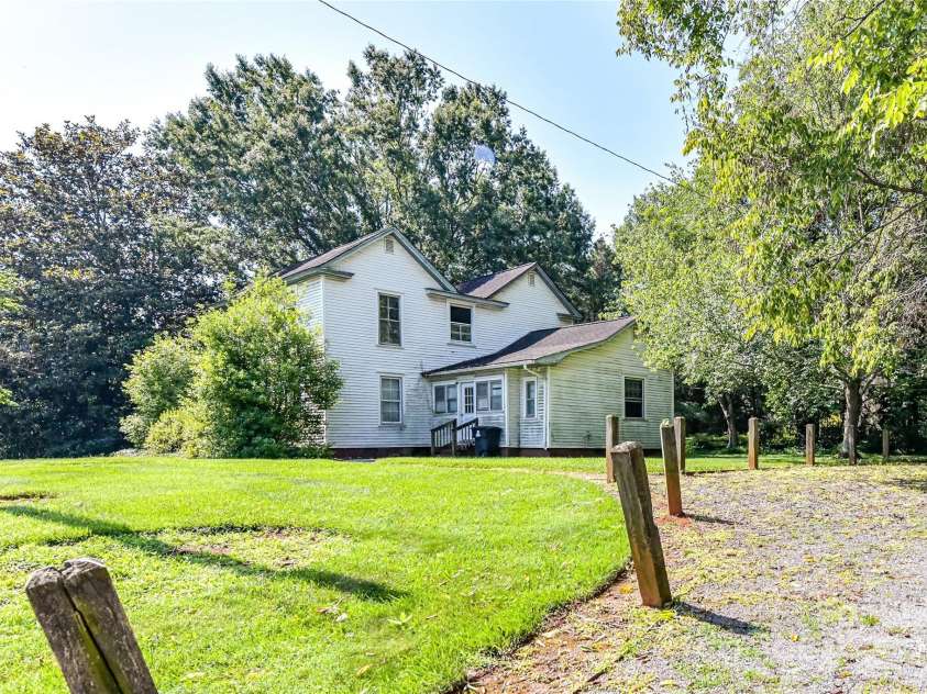 504 Potts Street, Davidson, NC 28036.  MLS# CAR4274445, YatesRealty ID 32365. It has 300' of road footage on Catawba Avenue and 100' of road frontage on Potts Street. Appears to set up nicely for three lots with 100' frontage each and rear depth of 100' - roughly .215 acres each.