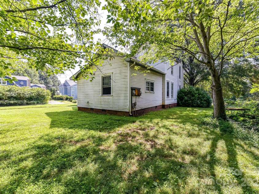 504 Potts Street, Davidson, NC 28036.  MLS# CAR4274445, YatesRealty ID 32365. Lovely old trees on the south side of lot