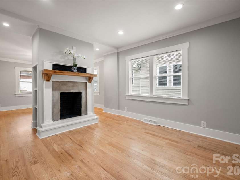 174 Tournament Drive, Concord, NC 28025.  MLS# CAR4385938, YatesRealty ID 32368. Double sided fireplace in the dining room