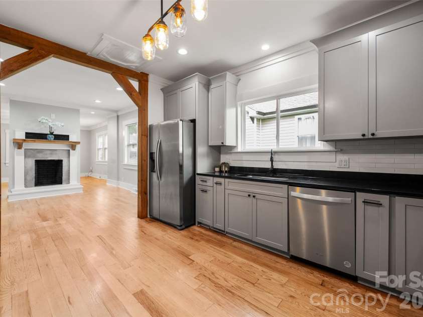 174 Tournament Drive, Concord, NC 28025.  MLS# CAR4385938, YatesRealty ID 32368. Kitchen looking into the dining room