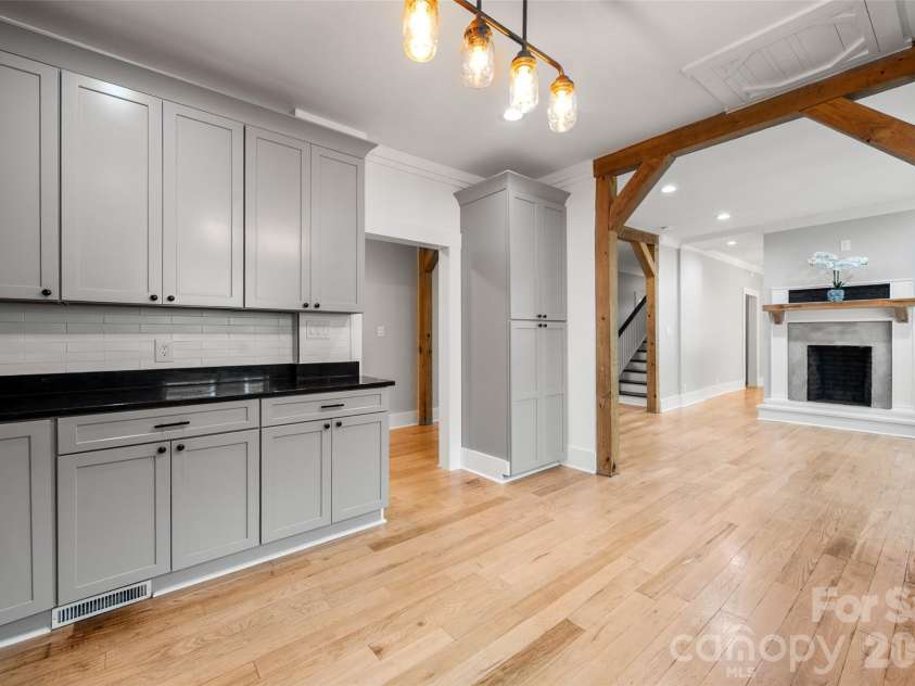 174 Tournament Drive, Concord, NC 28025.  MLS# CAR4385938, YatesRealty ID 32368. Kitchen looking into the dining room and hallway