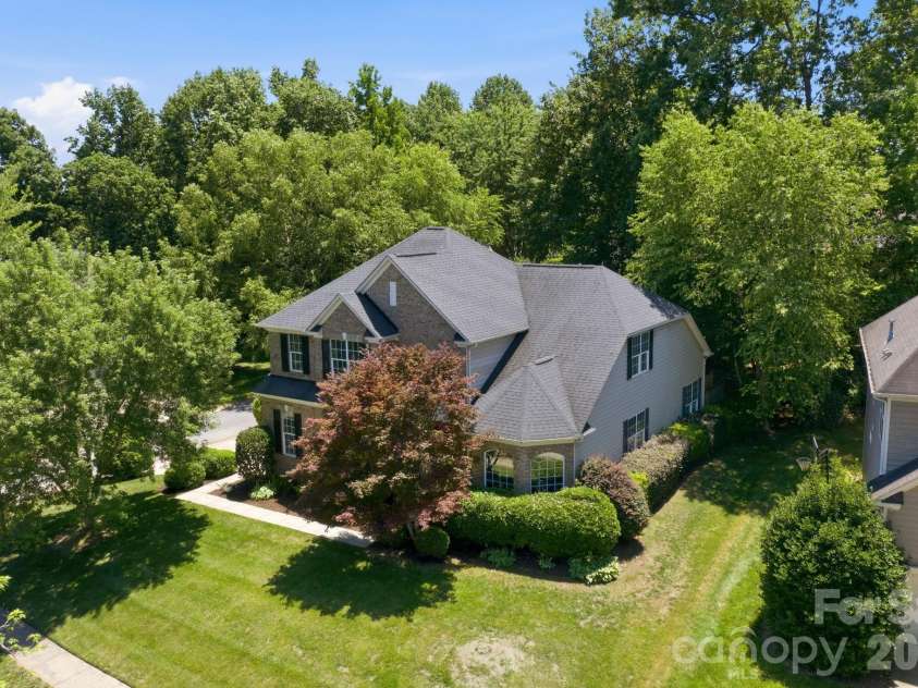 12440 Kane Alexander Drive, Huntersville, NC 28078.  MLS# CAR4390522, YatesRealty ID 32369. A corner lot with a lovely, executive home