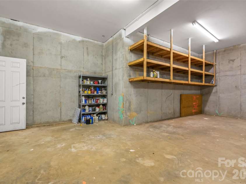 424 Rollingbrook Road, Kings Mountain, NC 28086.  MLS# CAR4318684, YatesRealty ID 3237. Basement level 2-bay garage with elevated ceiling.  Steel I-beam supported