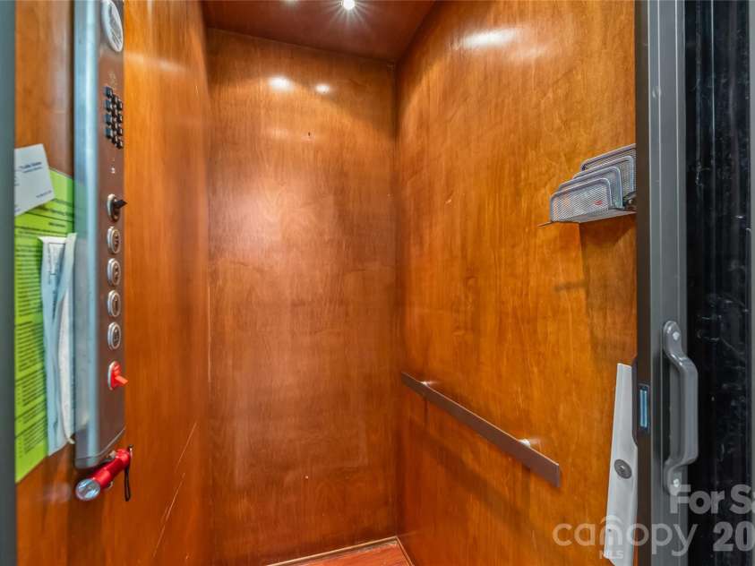 424 Rollingbrook Road, Kings Mountain, NC 28086.  MLS# CAR4318684, YatesRealty ID 3237. Interior view of residential elevator with wood panel finish.