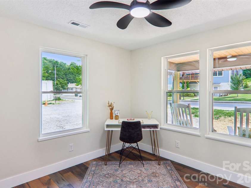 169 East Street, Waynesville, NC 28786.  MLS# CAR4394289, YatesRealty ID 32372. Front bedroom (1 of 3), can also be office 