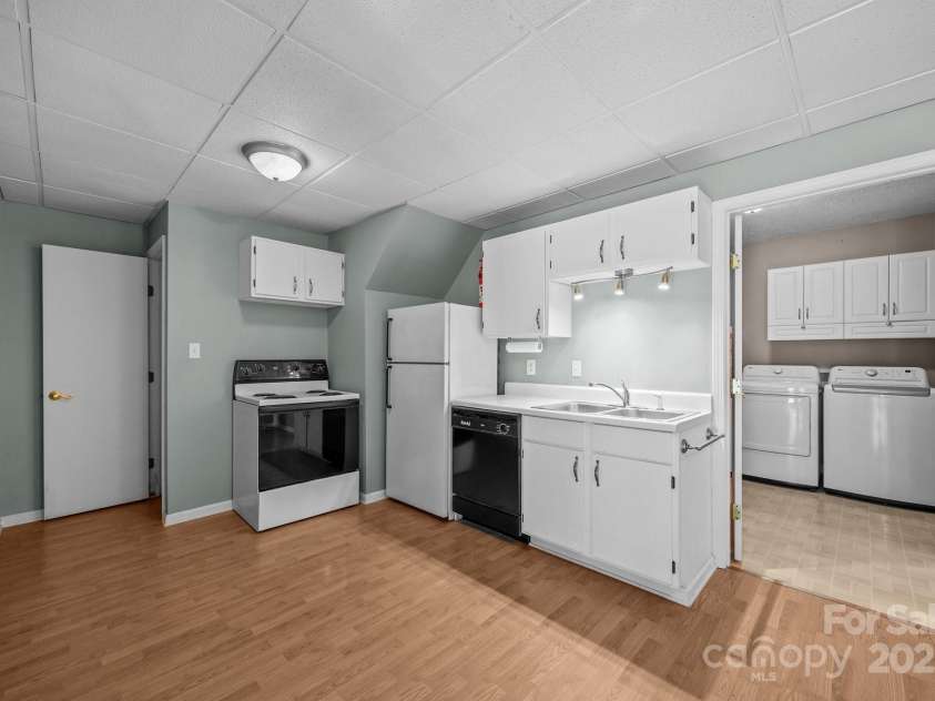 64 Christopher Lane, Sylva, NC 28779.  MLS# CAR4274433, YatesRealty ID 32378. Downstairs Kitchenette