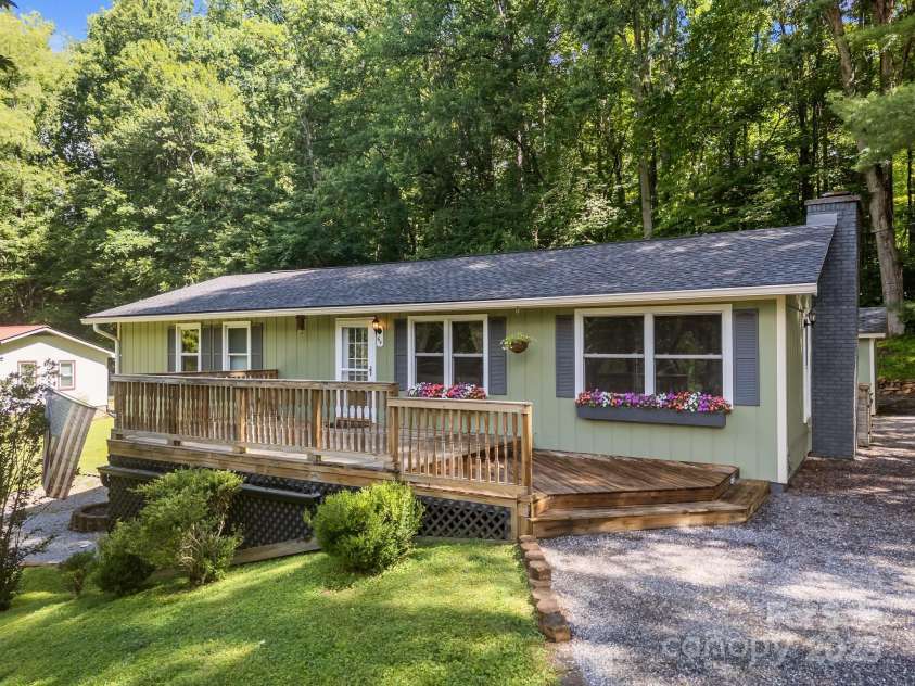 64 Christopher Lane, Sylva, NC 28779.  MLS# CAR4274433, YatesRealty ID 32378. Large Front porch with ample parking spaces