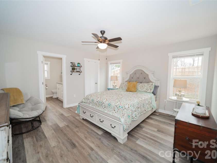 1338 Eastside Avenue, Albemarle, NC 28001.  MLS# CAR4342335, YatesRealty ID 3238. A comfortable primary suite offering privacy and a peaceful place to unwind while overlooking the backyard.