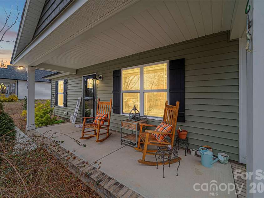 1338 Eastside Avenue, Albemarle, NC 28001.  MLS# CAR4342335, YatesRealty ID 3238. Just three years old, this charming cottage-style home offers low-maintenance living with modern curb appeal.